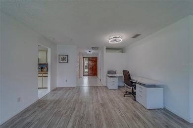 Welcome home to this light and airy 2 bedroom/2 bathroom corner on Mainlands Golf Club in Florida - for sale on GolfHomes.com, golf home, golf lot