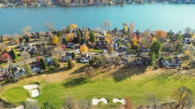 Discover the perfect blend of serene lake living and modern on Lake Mohawk Golf Club in New Jersey - for sale on GolfHomes.com, golf home, golf lot