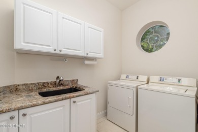 Welcome to this meticulously maintained custom home designed by on Halifax Plantation Golf Club in Florida - for sale on GolfHomes.com, golf home, golf lot
