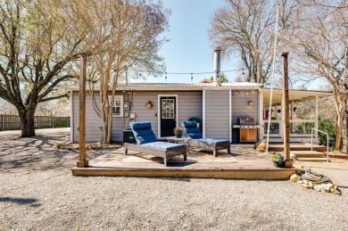Nestled in a peaceful, wooded setting, this charming 3-bedroom on Tanglewood Resort in Texas - for sale on GolfHomes.com, golf home, golf lot