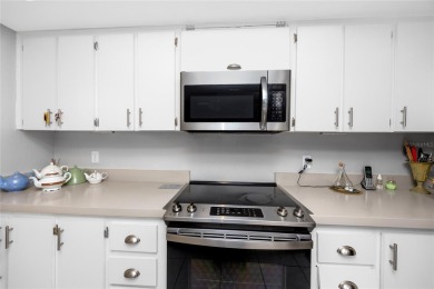 Welcome to this beautifully updated 2-bedroom, 2-bath corner on Cove Cay Country Club in Florida - for sale on GolfHomes.com, golf home, golf lot