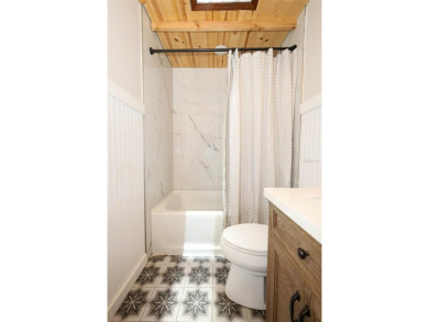Discover comfort and privacy in this charming and updated on Rio Pinar Golf and Country Club in Florida - for sale on GolfHomes.com, golf home, golf lot