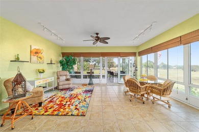 WOW is what you'll say as you step inside this custom Coral on Eagle Ridge At Spruce Creek Country Club in Florida - for sale on GolfHomes.com, golf home, golf lot