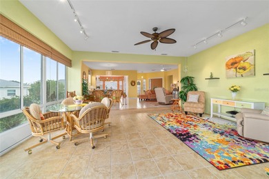 WOW is what you'll say as you step inside this custom Coral on Eagle Ridge At Spruce Creek Country Club in Florida - for sale on GolfHomes.com, golf home, golf lot