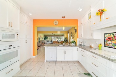 WOW is what you'll say as you step inside this custom Coral on Eagle Ridge At Spruce Creek Country Club in Florida - for sale on GolfHomes.com, golf home, golf lot