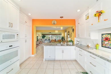 WOW is what you'll say as you step inside this custom Coral on Eagle Ridge At Spruce Creek Country Club in Florida - for sale on GolfHomes.com, golf home, golf lot