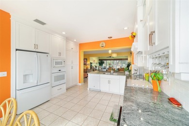 WOW is what you'll say as you step inside this custom Coral on Eagle Ridge At Spruce Creek Country Club in Florida - for sale on GolfHomes.com, golf home, golf lot