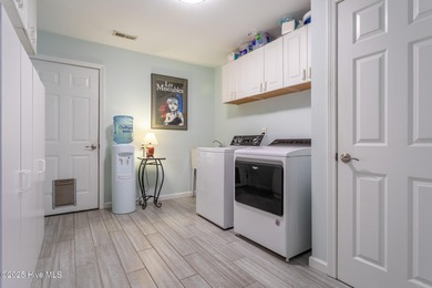 This gorgeous 3-bedroom, 2-bath home is located in The Albemarle on Sound Golf Links at Albemarle Plantation in North Carolina - for sale on GolfHomes.com, golf home, golf lot