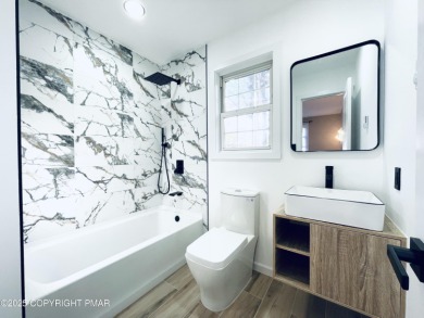 This MODERN, FULLY RENOVATED Colonial-Style Home with three on Pocono Farms Country Club in Pennsylvania - for sale on GolfHomes.com, golf home, golf lot