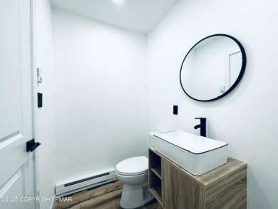 This MODERN, FULLY RENOVATED Colonial-Style Home with three on Pocono Farms Country Club in Pennsylvania - for sale on GolfHomes.com, golf home, golf lot