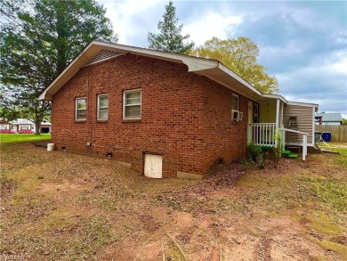 This spacious, well kept brick ranch home is full of potential on Reynolds Park Golf Course in North Carolina - for sale on GolfHomes.com, golf home, golf lot