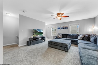 Discover your perfect retreat in this move-in-ready townhome on Meadow Ponds Golf and Country Club in West Virginia - for sale on GolfHomes.com, golf home, golf lot