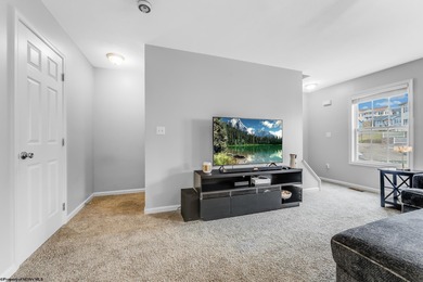 Discover your perfect retreat in this move-in-ready townhome on Meadow Ponds Golf and Country Club in West Virginia - for sale on GolfHomes.com, golf home, golf lot