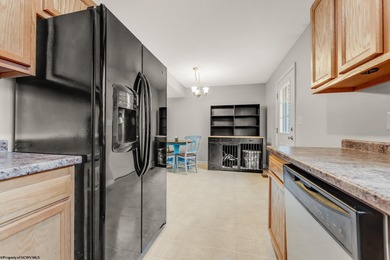 Discover your perfect retreat in this move-in-ready townhome on Meadow Ponds Golf and Country Club in West Virginia - for sale on GolfHomes.com, golf home, golf lot