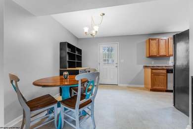 Discover your perfect retreat in this move-in-ready townhome on Meadow Ponds Golf and Country Club in West Virginia - for sale on GolfHomes.com, golf home, golf lot