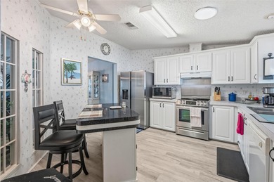 Check out this beautiful, 55+ community that is full of trees on Rivard Golf and Country Club in Florida - for sale on GolfHomes.com, golf home, golf lot