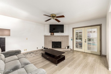 Open and bright living spaces flow from the crisp white kitchen on Gainey Ranch Golf Club in Arizona - for sale on GolfHomes.com, golf home, golf lot