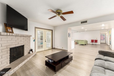 Open and bright living spaces flow from the crisp white kitchen on Gainey Ranch Golf Club in Arizona - for sale on GolfHomes.com, golf home, golf lot