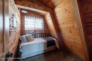 Nestled among a serene canopy of mature trees, this charming on Star Valley RV Golf Course in Wyoming - for sale on GolfHomes.com, golf home, golf lot