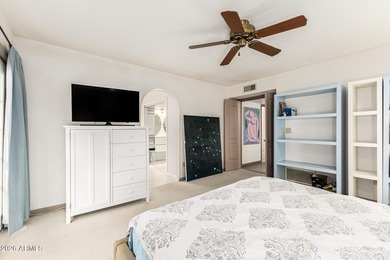 Open and bright living spaces flow from the crisp white kitchen on Gainey Ranch Golf Club in Arizona - for sale on GolfHomes.com, golf home, golf lot