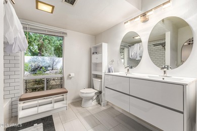 Open and bright living spaces flow from the crisp white kitchen on Gainey Ranch Golf Club in Arizona - for sale on GolfHomes.com, golf home, golf lot