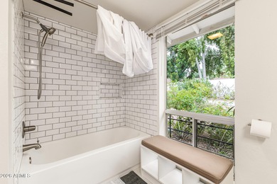 Open and bright living spaces flow from the crisp white kitchen on Gainey Ranch Golf Club in Arizona - for sale on GolfHomes.com, golf home, golf lot
