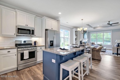 This beautiful and well-maintained coastal home is within on Cape Fear National At Brunswick Forest in North Carolina - for sale on GolfHomes.com, golf home, golf lot
