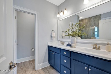 This beautiful and well-maintained coastal home is within on Cape Fear National At Brunswick Forest in North Carolina - for sale on GolfHomes.com, golf home, golf lot
