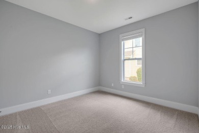 This beautiful and well-maintained coastal home is within on Cape Fear National At Brunswick Forest in North Carolina - for sale on GolfHomes.com, golf home, golf lot