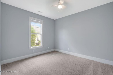 This beautiful and well-maintained coastal home is within on Cape Fear National At Brunswick Forest in North Carolina - for sale on GolfHomes.com, golf home, golf lot