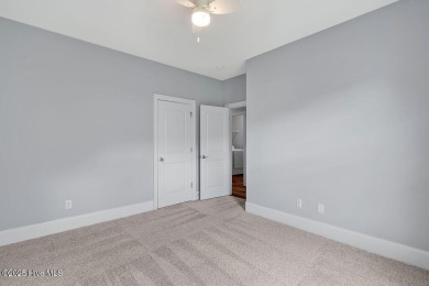 This beautiful and well-maintained coastal home is within on Cape Fear National At Brunswick Forest in North Carolina - for sale on GolfHomes.com, golf home, golf lot