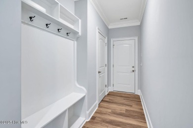 This beautiful and well-maintained coastal home is within on Cape Fear National At Brunswick Forest in North Carolina - for sale on GolfHomes.com, golf home, golf lot