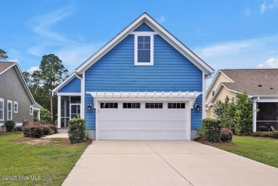 This beautiful and well-maintained coastal home is within on Cape Fear National At Brunswick Forest in North Carolina - for sale on GolfHomes.com, golf home, golf lot