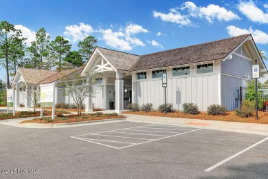 This beautiful and well-maintained coastal home is within on Cape Fear National At Brunswick Forest in North Carolina - for sale on GolfHomes.com, golf home, golf lot