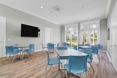 This beautiful and well-maintained coastal home is within on Cape Fear National At Brunswick Forest in North Carolina - for sale on GolfHomes.com, golf home, golf lot