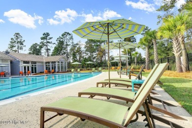This beautiful and well-maintained coastal home is within on Cape Fear National At Brunswick Forest in North Carolina - for sale on GolfHomes.com, golf home, golf lot