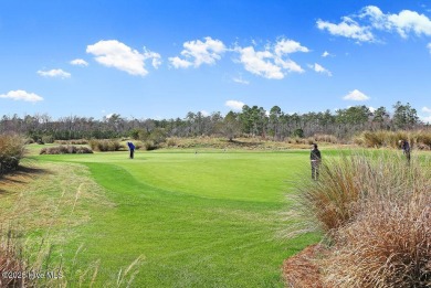 This beautiful and well-maintained coastal home is within on Cape Fear National At Brunswick Forest in North Carolina - for sale on GolfHomes.com, golf home, golf lot