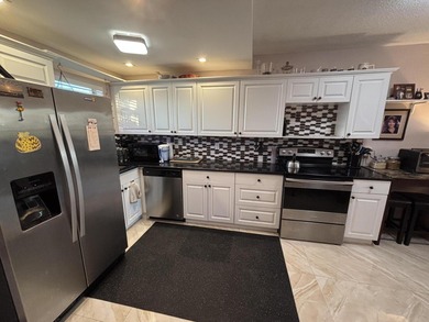 Enjoy picturesque golf course views from this open floor plan on Leisureville Community Association in Florida - for sale on GolfHomes.com, golf home, golf lot