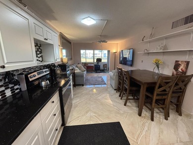 Enjoy picturesque golf course views from this open floor plan on Leisureville Community Association in Florida - for sale on GolfHomes.com, golf home, golf lot