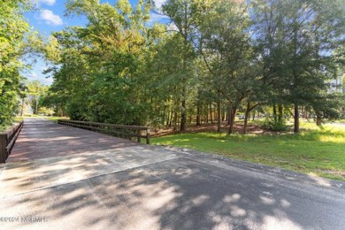 This unique 0.16-acre lot is located on a corner in Winding on Carolina National Golf Club in North Carolina - for sale on GolfHomes.com, golf home, golf lot