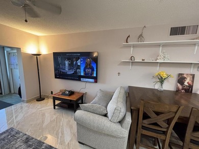 Enjoy picturesque golf course views from this open floor plan on Leisureville Community Association in Florida - for sale on GolfHomes.com, golf home, golf lot