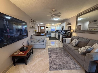 Enjoy picturesque golf course views from this open floor plan on Leisureville Community Association in Florida - for sale on GolfHomes.com, golf home, golf lot