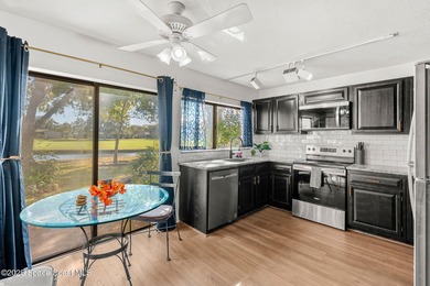 Spectacular lake, golf course, and tree-lined views! A welcoming on Suntree Country Club in Florida - for sale on GolfHomes.com, golf home, golf lot