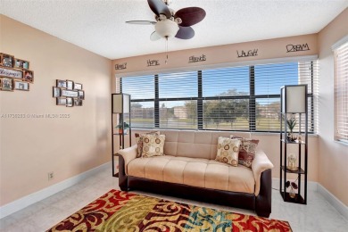 Welcome Home to this spacious unit overlooking the tranquil on Sunrise Lakes Phase IV Golf Course in Florida - for sale on GolfHomes.com, golf home, golf lot