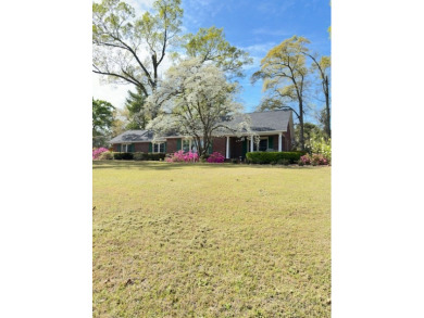 Brick ranch-style home with three bedrooms, two baths, within on Santee National Golf Course in South Carolina - for sale on GolfHomes.com, golf home, golf lot