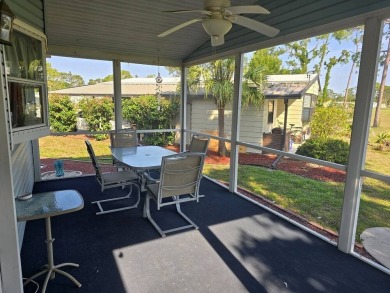 This lovely 2-bedroom partially furnished home on a corner lot on Pine Lakes Country Club in Florida - for sale on GolfHomes.com, golf home, golf lot