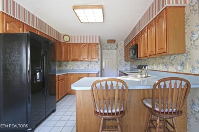 Welcome to this charming home in The Greens at Toqua within on Toqua Golf Course - Loudon County in Tennessee - for sale on GolfHomes.com, golf home, golf lot