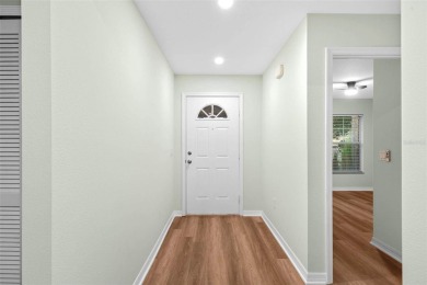 Discover the charm and elegance of this beautifully updated home on Arlington Ridge Golf Club in Florida - for sale on GolfHomes.com, golf home, golf lot