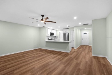 Discover the charm and elegance of this beautifully updated home on Arlington Ridge Golf Club in Florida - for sale on GolfHomes.com, golf home, golf lot