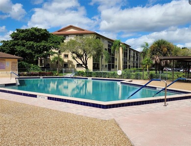Located in the desirable Plymouth section of Century Village on Flamingo Lakes Country Club in Florida - for sale on GolfHomes.com, golf home, golf lot